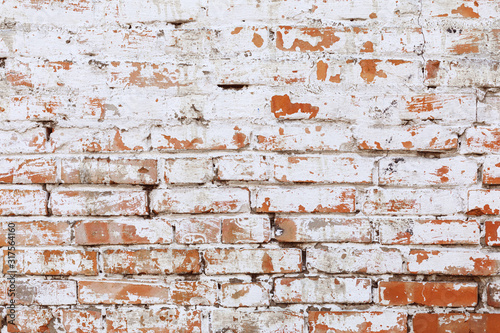 Rustic red brick background with white paint