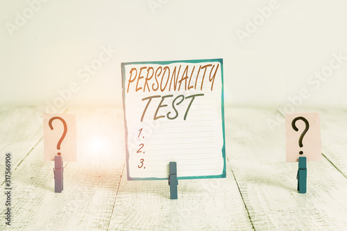 Writing note showing Personality Test. Business concept for A method of assessing huanalysis demonstratingality constructs Crumbling sheet with paper clips placed on the wooden table photo