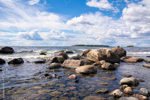 Coastal view of Isosaari island, stones on the shore and Gulf of Finland, Helsinki, Finland