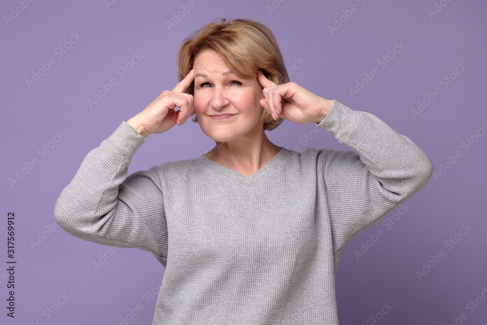 Senior caucasian woman generating idea trying to plan making right stragedy. Studio shot Senior caucasian woman generating idea trying to plan making right stragedy. Studio shot