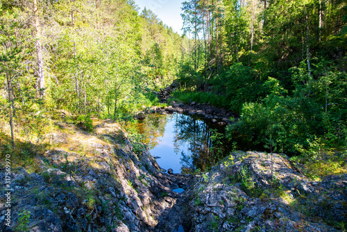 Fototapeta Naklejka Na Ścianę i Meble -  View of Kiutakongas Rapids area, rocks, trees and water, Oulanka National Park, Kuusamo, Finland