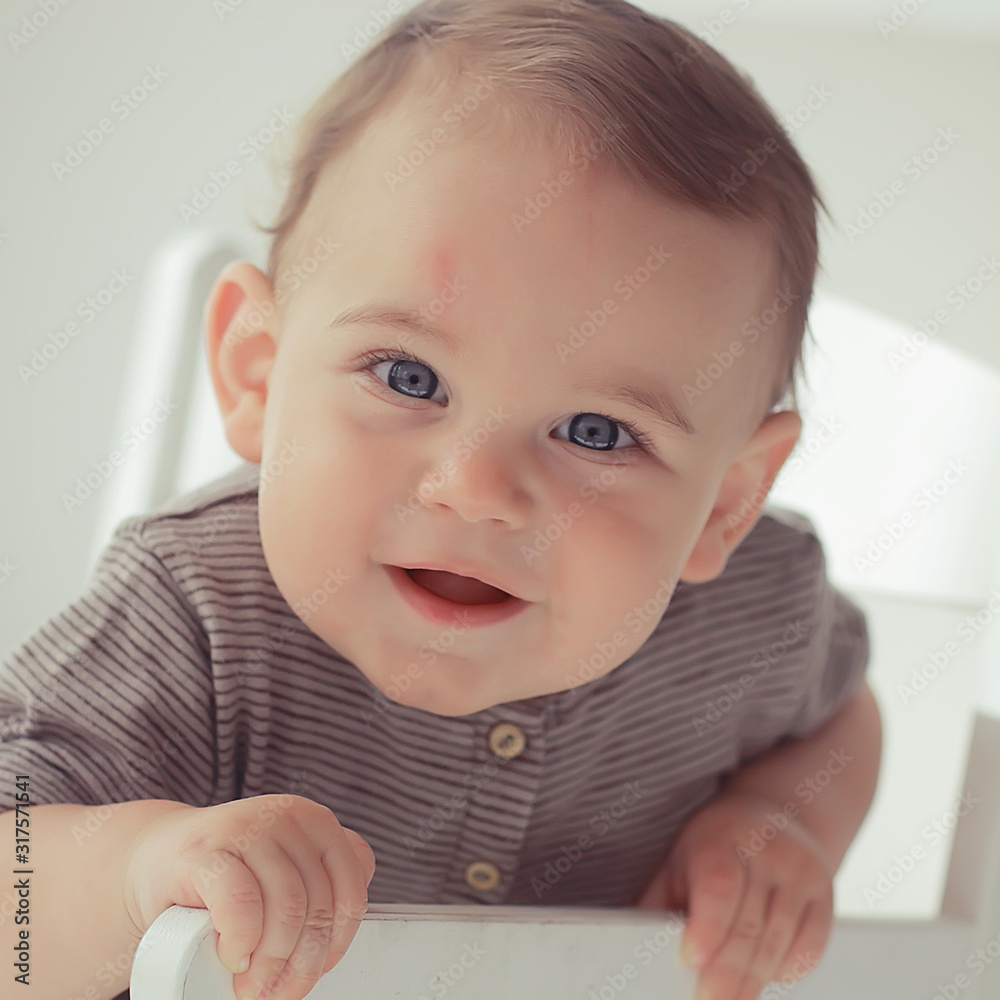 cheerful healthy baby smiling / portrait of a small child, boy little son cheerful health