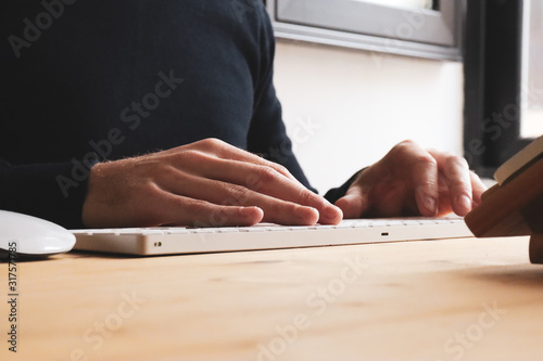 Businessmen's hands typing on laptop keybord
