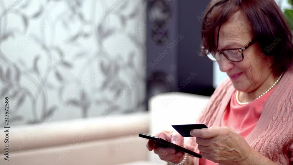 Senior Woman Using Mobile Phone And Credit Card Shopping Online Outdoors.Mature Woman Online Banking With Smartphone And App.Enter Credit Card Number Online Payments In Internet.Elderly Online Payment Senior Woman Using Mobile Phone And Credit Card Shopping Online Outdoors.Mature Woman Online Banking With Smartphone And App.Enter Credit Card Number Online Payments In Internet.Elderly Online Payment