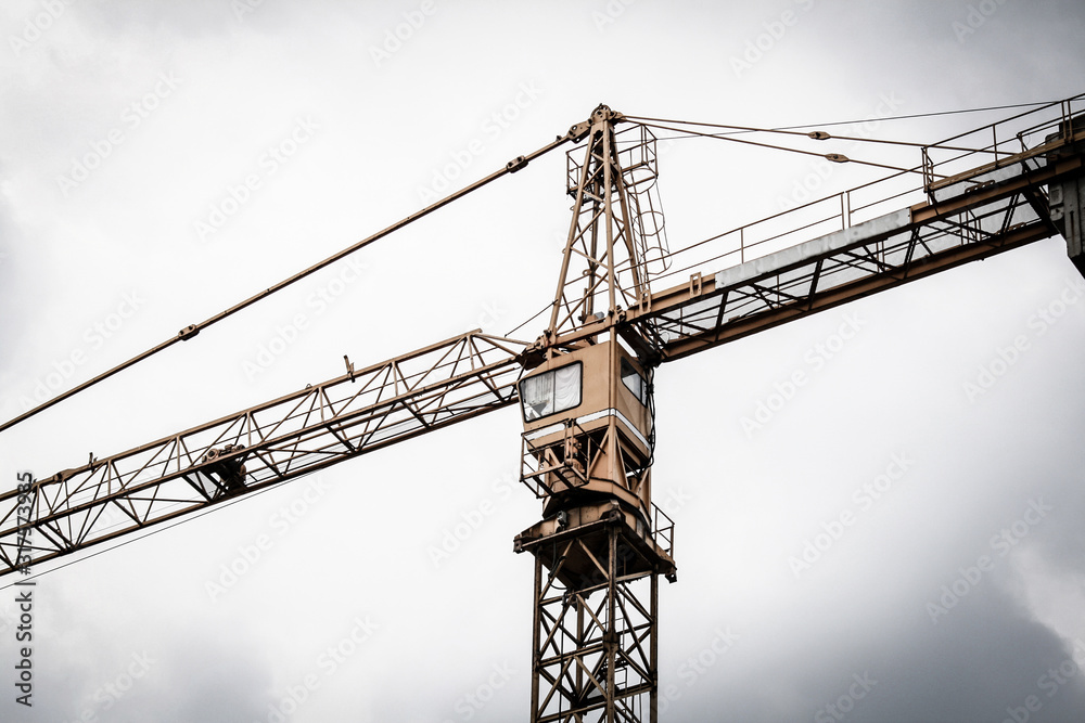 Crane against cloudy sky