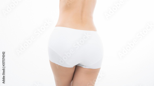 Close up beautiful fit woman slim body in white panties isolated on white background