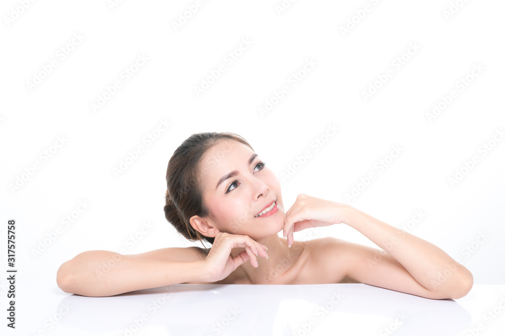 Charming young asian woman with clean fresh skin, Hair sleek, Proposing a product while lying on isolated on white background, Front view, copy space on the top. Charming young asian woman with clean fresh skin, Hair sleek, Proposing a product while lying on isolated on white background, Front view, copy space on the top.