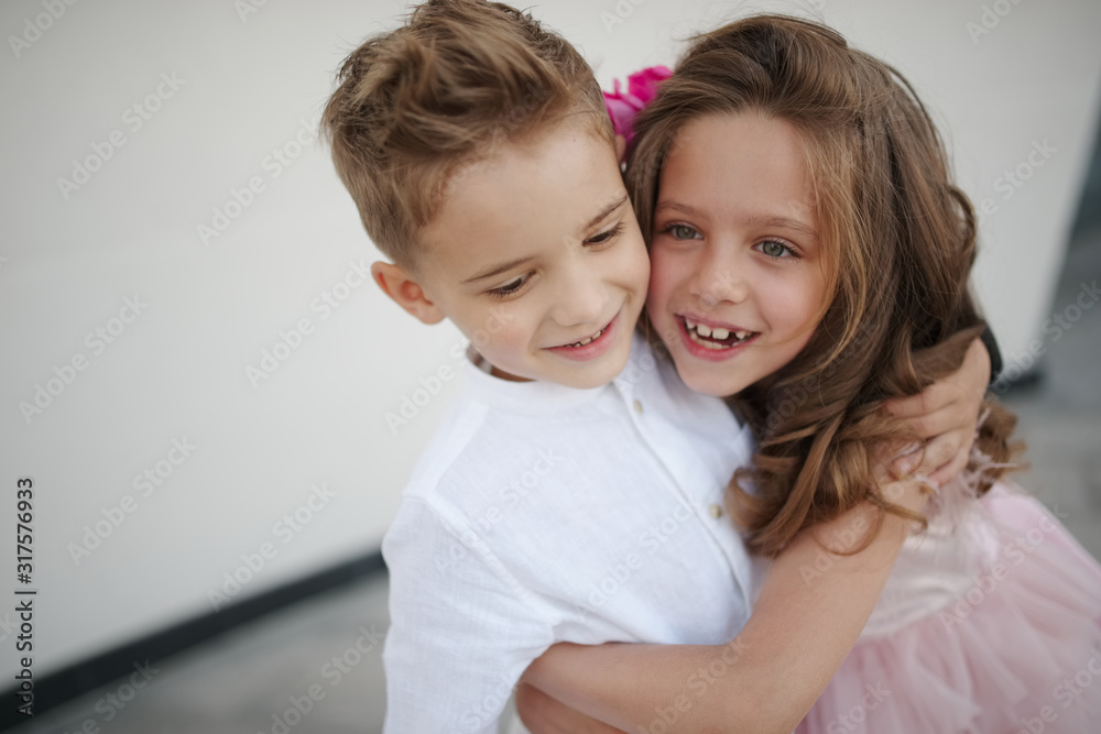 young happy boy and girl together outside young happy boy and girl together outside