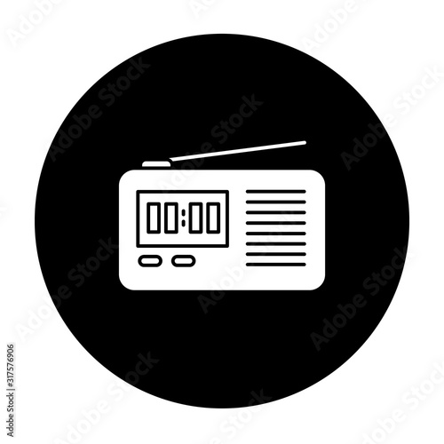 Wireless radio set glyph icon. Portable electronic receiver. Signal transmitting apparatus. Compact receiving system. Mobile device. Technology. Vector white silhouette illustration in black circle