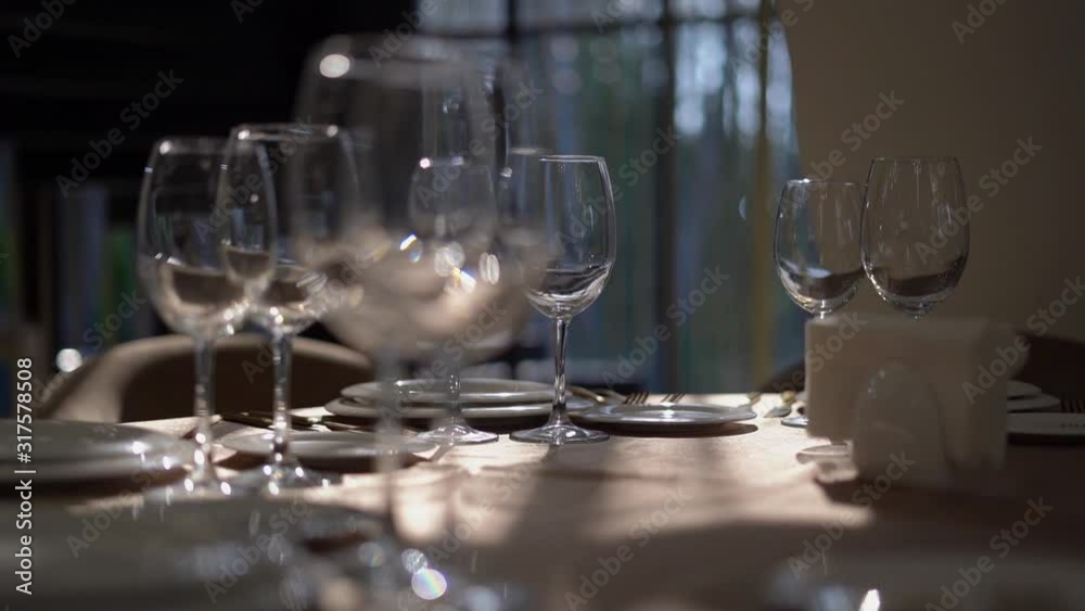 Beautiful table setting with glasses, plates and napkins. Clouse-up. Beautiful table setting with glasses, plates and napkins. Clouse-up.