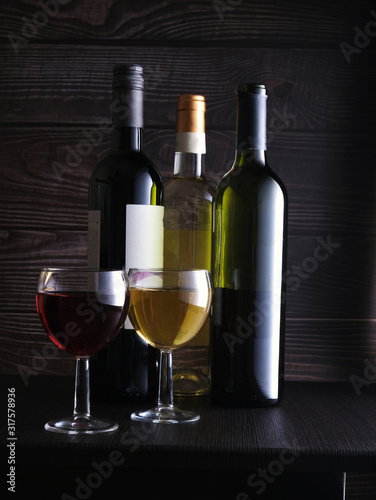 two glasses with red and white wine