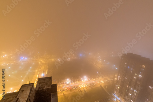 New Belgrade, Serbia - January 13, 2020: New Belgrade covered with fog photographed from a tall building