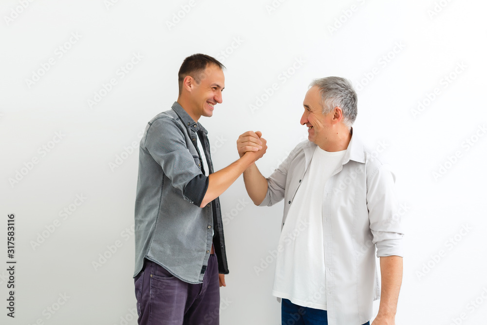 Senior Father With Adult Son on a white background