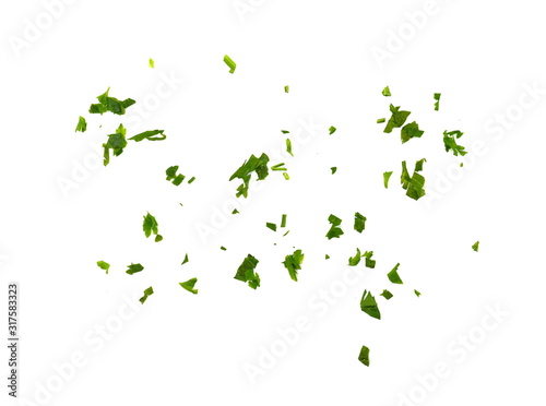 Foto Fresh green chopped parsley leaves isolated on white background and texture, top view