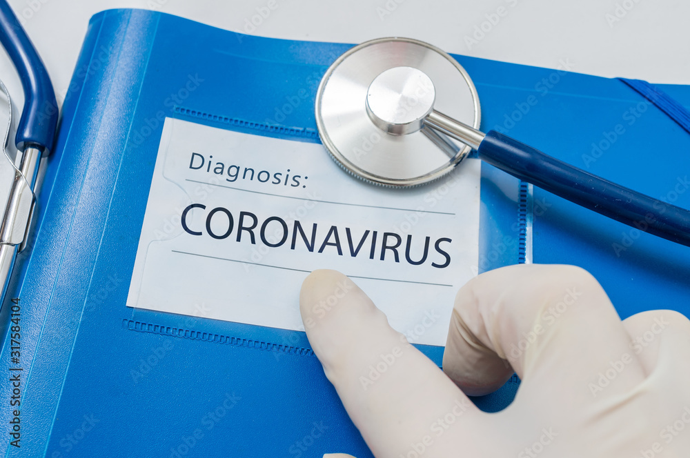 Fototapeta Novel coronavirus disease 2019-nCoV written on blue folder.