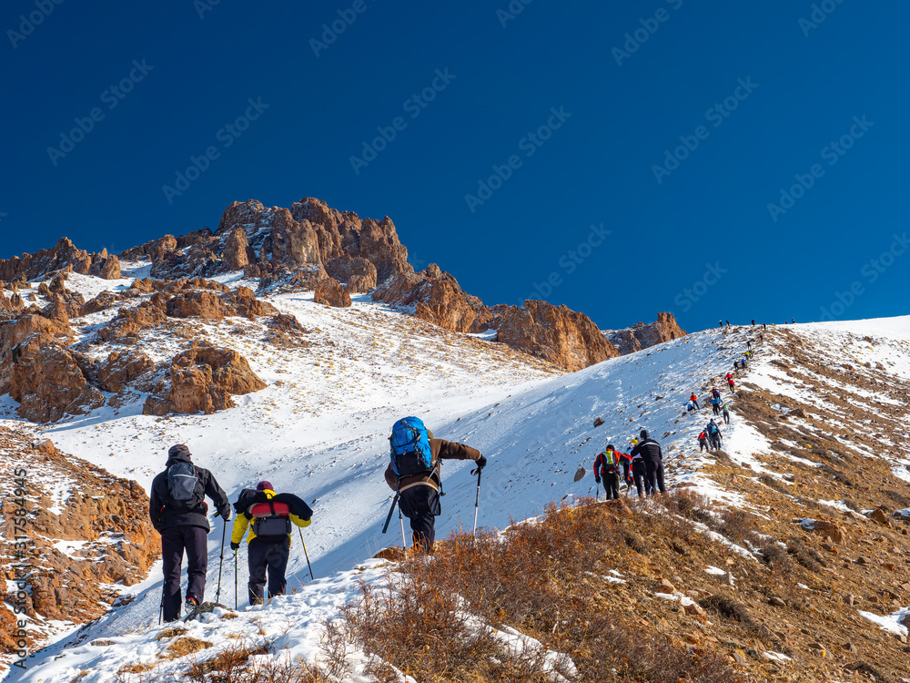 Tourists climb to the top of the mountain. Skyrunning competitions