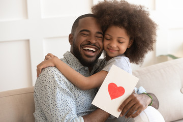 African daddy on Father Day received from caring daughter postcard