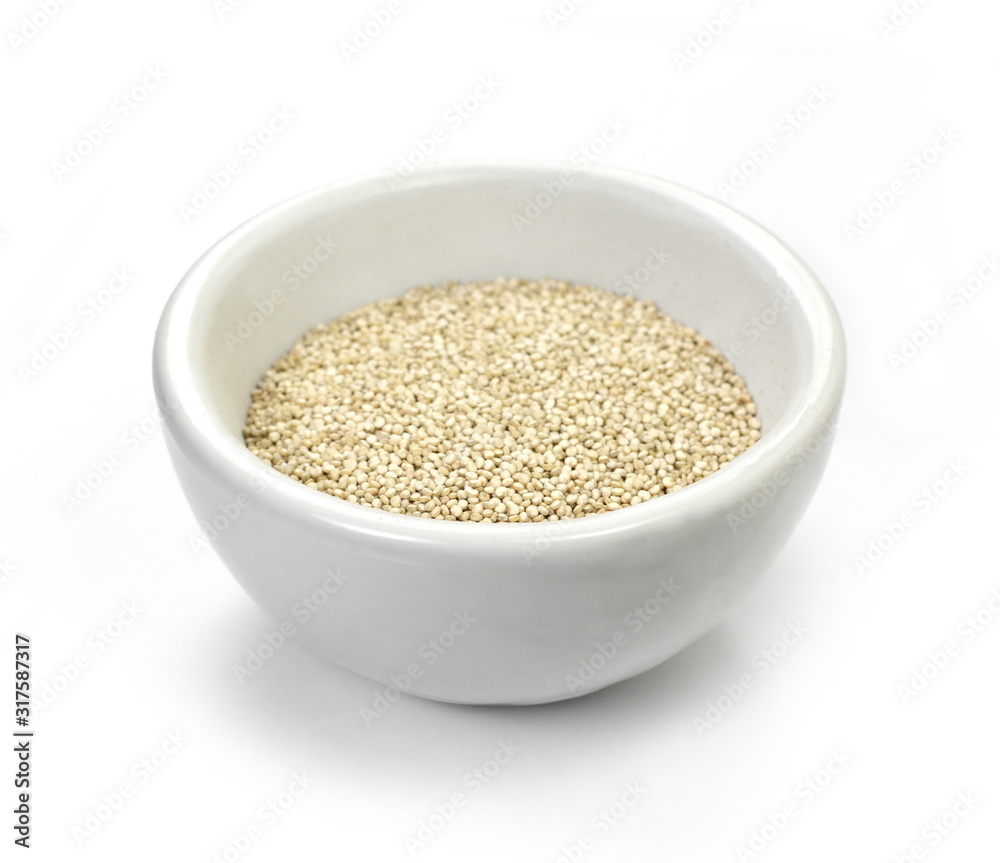 Organic Quinoa (Chenopodium quinoa) seeds in a white bowl isolated on white background. Macro close up. Top view. quinoa seeds isolated on white background. Organic Quinoa (Chenopodium quinoa) seeds in a white bowl isolated on white background. Macro close up. Top view. quinoa seeds isolated on white background.