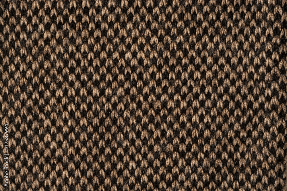 The background is made of knitted fabric brown and black. Chess location vertically The background is made of knitted fabric brown and black. Chess location vertically