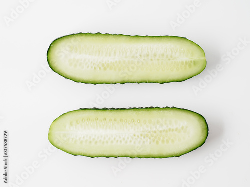 Fresh green cucumber on white background.