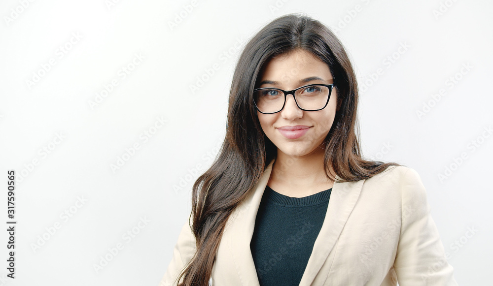 Portrait of smiling young dark haired woman wearing spectacles isolated on white background looking at camera Portrait of smiling young dark haired woman wearing spectacles isolated on white background looking at camera