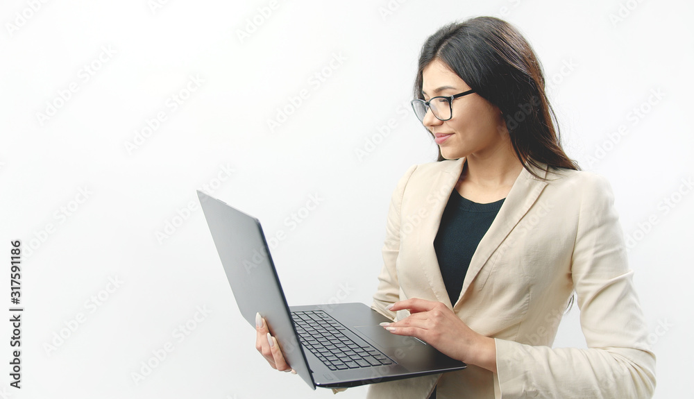 Portrait of attractive cheerful brunette using laptop holding it in her hands, isolated white background Portrait of attractive cheerful brunette using laptop holding it in her hands, isolated white background