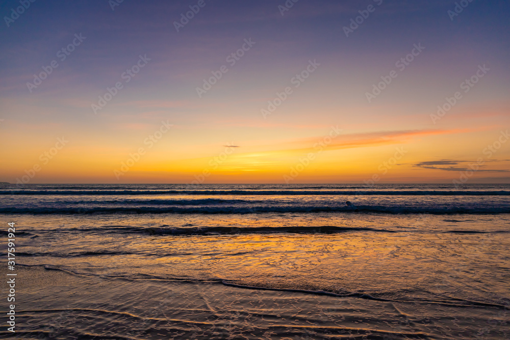 Beautiful sunset on the ocean Kuta beach of Bali island, Indonesia