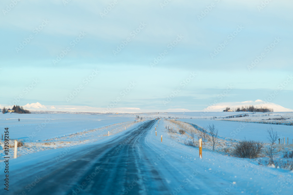 Picturesque winter landscape of Iceland. The perfect road to perspective Picturesque winter landscape of Iceland. The perfect road to perspective