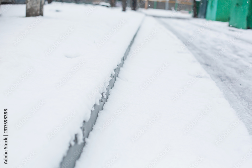 Snow covered city street close up a Snow covered city street close up a