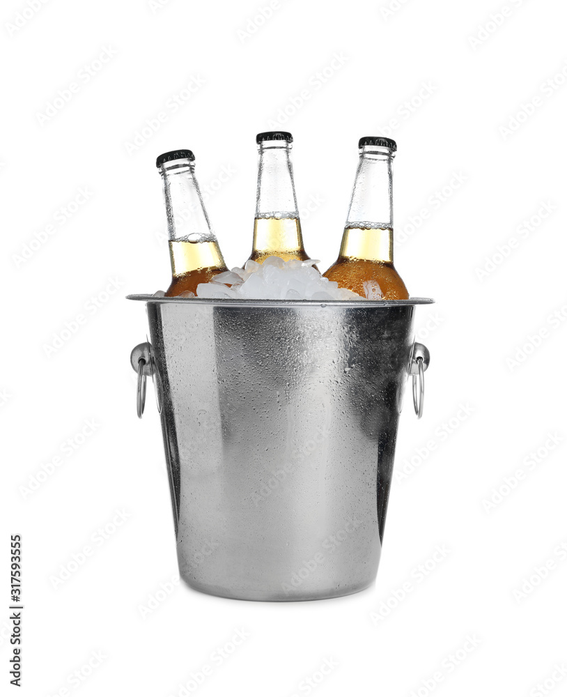 Beer in metal bucket with ice isolated on white Beer in metal bucket with ice isolated on white