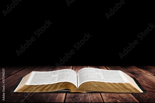 Open vintage christian bible on background