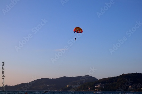 Parasailing at Patong Phuket Thailand at Sunset beautiful colours