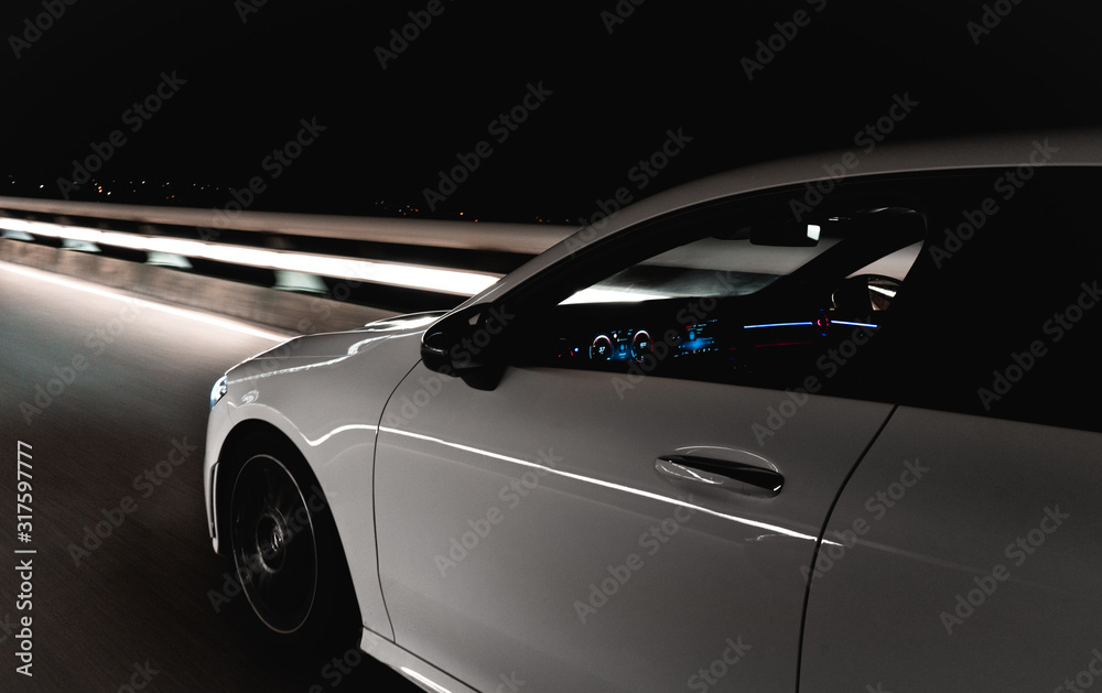 Sports car on the road at night Sports car on the road at night