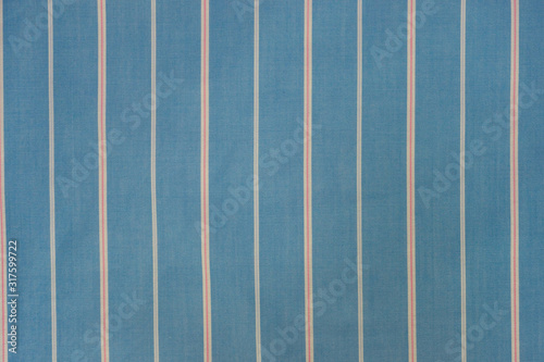  blue fabric with  vertical white and red stripes