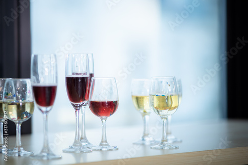 A glass of wine that is placed at a party