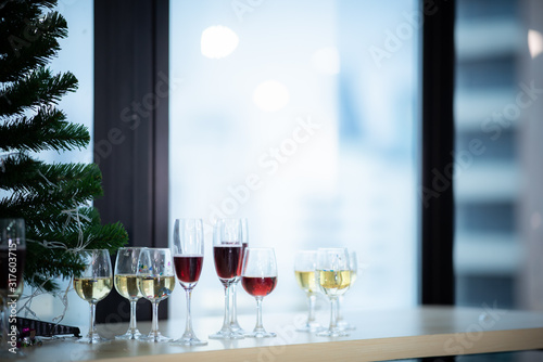 A glass of wine that is placed at a party