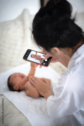 Mother is using the phone t...