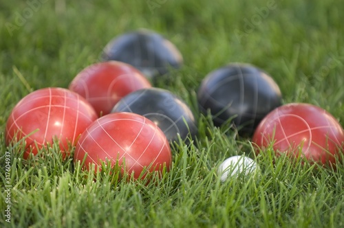 Принти на полотні Picture of colourful bocce balls on the lawn under the sunlight with a blurry ba