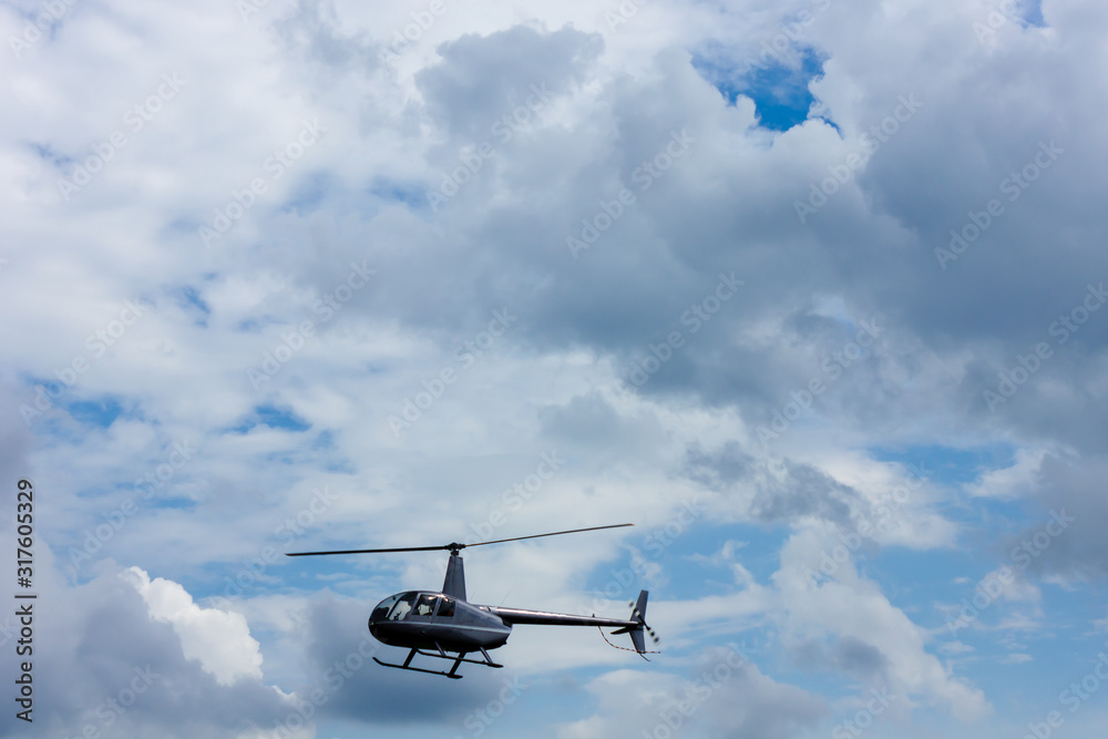 helicopter chopper with two passengers in the sky helicopter chopper with two passengers in the sky