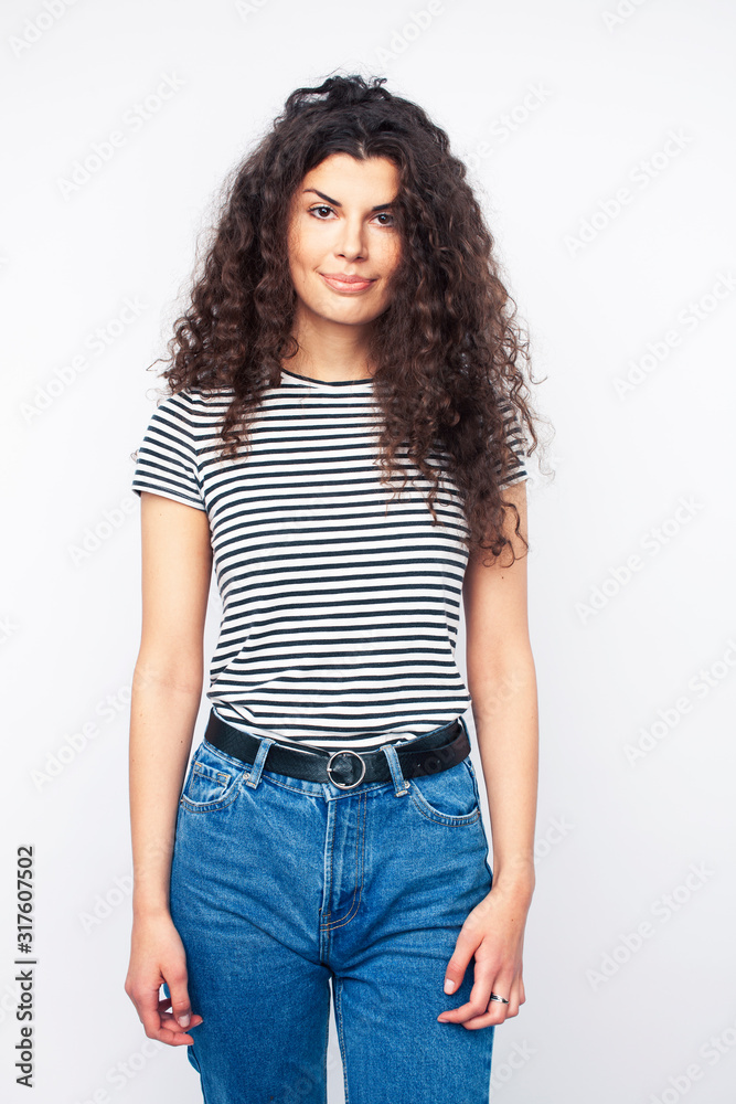 young brunette woman with curly hairstyle in bright casual clothers isolated on white background gesturing happy smiling, lifestyle people concept young brunette woman with curly hairstyle in bright casual clothers isolated on white background gesturing happy smiling, lifestyle people concept
