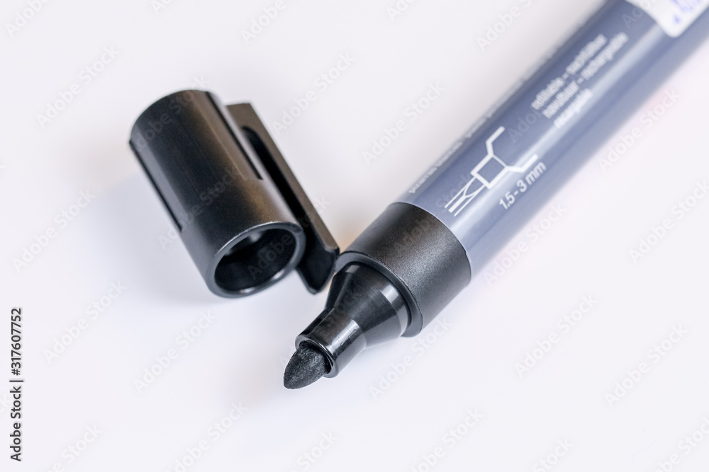 Black marker for white board, with cap removed. Close-up Black marker for white board, with cap removed. Close-up