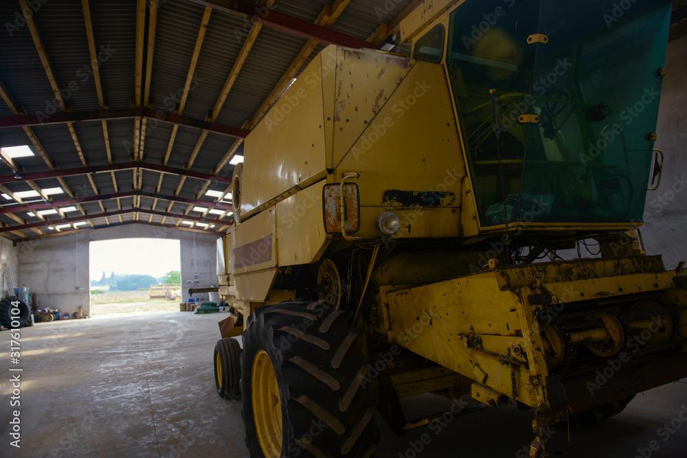 combine harvester in the garage