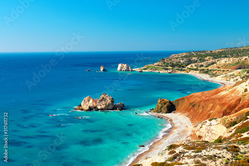 Seashore and pebble beach with wild coastline in Cyprus island, Greece by Petra tou Romiou sea rocks photo