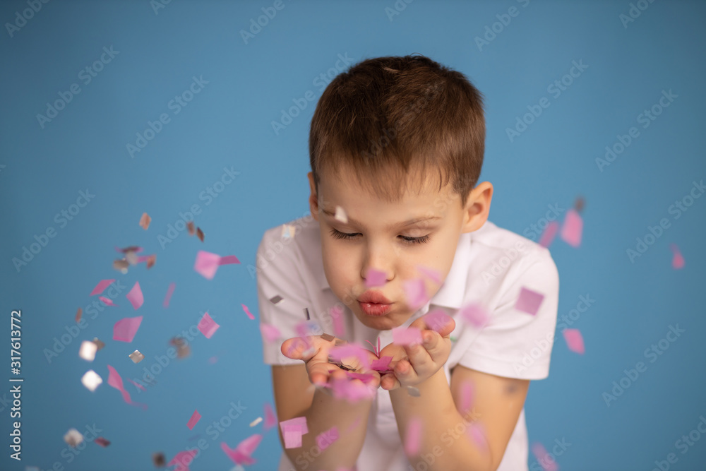 happy birthday boy with confetti on a colored blue background happy birthday boy with confetti on a colored blue background