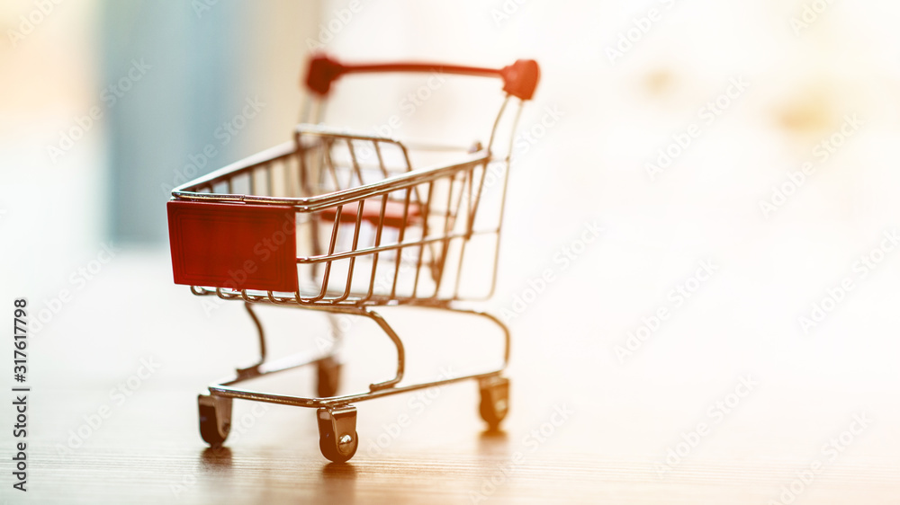Closeup focus of the shopping cart Online shopping concept Closeup focus of the shopping cart Online shopping concept