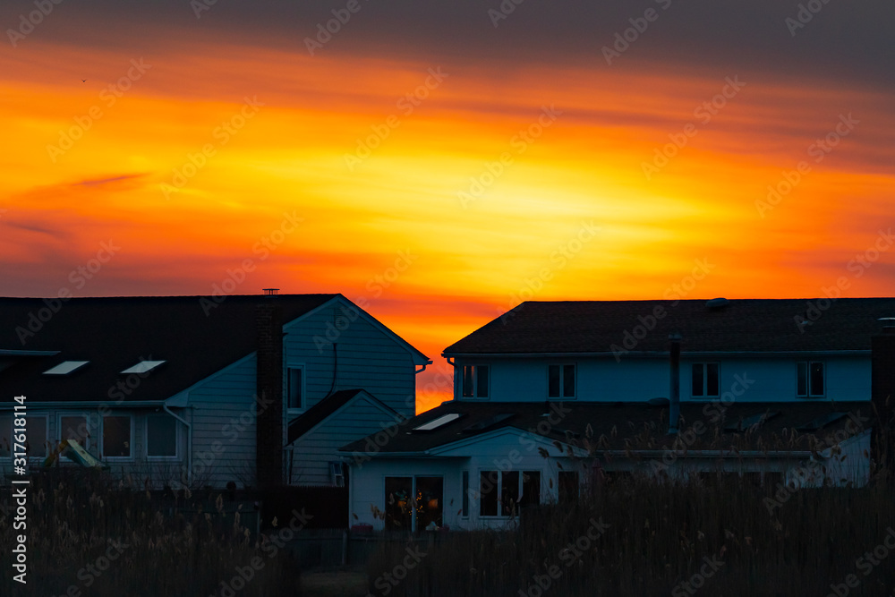 Sunset colors with houses at Long Island beach, New York Sunset colors with houses at Long Island beach, New York