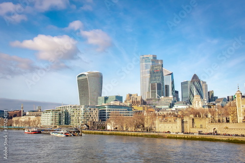 Buildings of the London United Kingdom skyline along the river Thames on a winter day