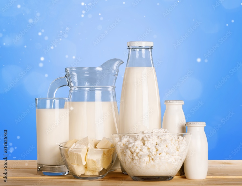 Fresh dairy products on wooden desk Fresh dairy products on wooden desk