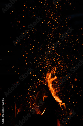 Embers Fly Above Flame photo