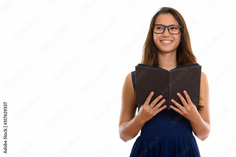 Portrait of happy young nerd woman thinking while holding book Portrait of happy young nerd woman thinking while holding book